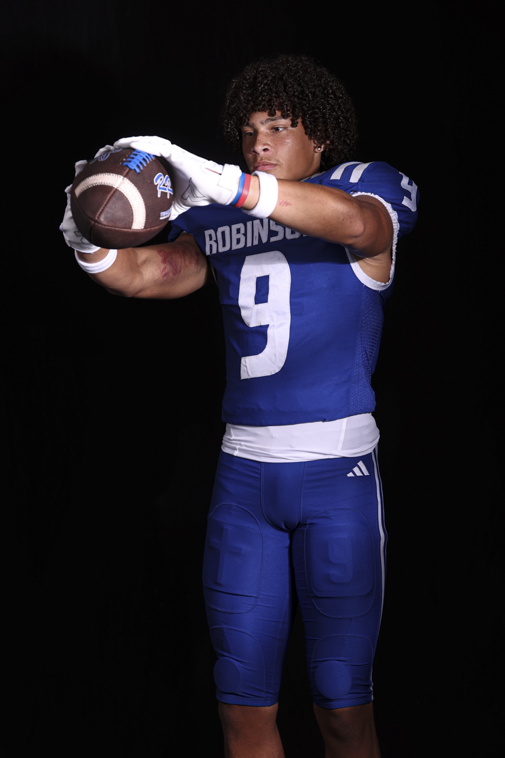 Robinson senior wide receiver Dylan Medlock holding a football
